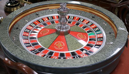 A roulette wheel by John Huxley Grosvenor casino diameter 80cm approx.